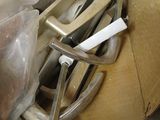 a pile of assorted metal items in a box