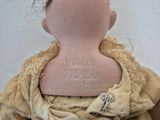 a doll that has a tattoo on it ' s back
