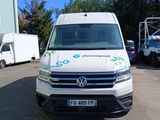a white van that is parked in a parking lot