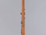 a close up of a musical instrument on a white surface