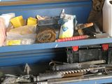 a blue work bench with a lot of tools on it