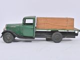 a green truck with a wooden box on the back