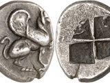 a close up of a silver coin with a bird on it