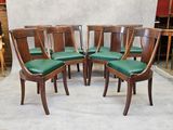 six chairs that are sitting in the middle of a room