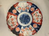 a plate with a design on it sitting on a table
