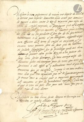 un vieux document écrit posé sur une table