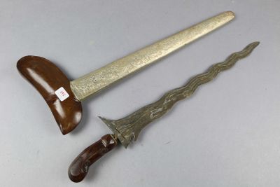 pair of antique bronzed swords with wooden handles