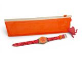 an image of a watch and a purse on a white surface