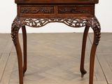 an old wooden table with a drawer on top of it