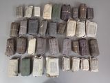 many old books stacked on top of each other on a table
