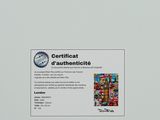 a picture of a certificate on the back of a refrigerator