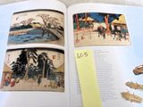 an open book with pictures of people and buildings on it