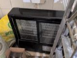 a microwave oven sitting in the corner of a room