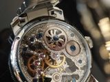 a close up of a watch on display on a table