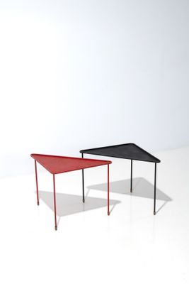 two tables that are sitting side by side on a white surface