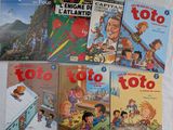 plusieurs livres pour enfants sont alignés sur une surface blanche