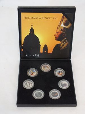 an image of a box of six coins with a picture of a man in a helmet