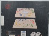 boxed picture of a game of dominos on a white table