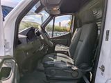 a white van with two seats in the back of it