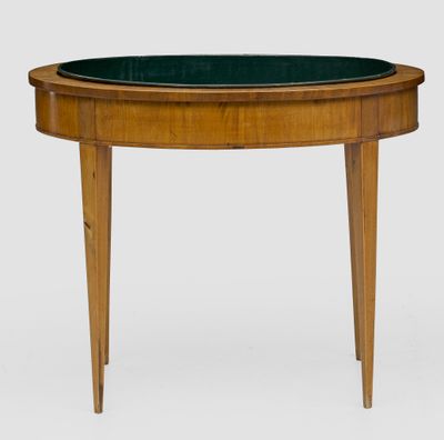 a round table with a green glass top and wooden legs