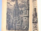 an open book with a picture of a city in it
