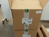 a large cardboard box sitting on a pallet in a warehouse