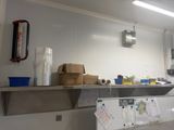 an image of a kitchen with a lot of clutter on the counter