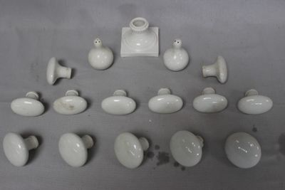 a lot of white rocks and a vase on a table