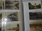 an open book with a bunch of old photos on it