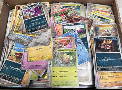 a box full of pokemon cards sitting on the floor