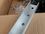 an image of a box with some metal parts in it