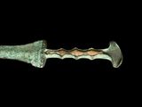 a close up of a knife on a black background