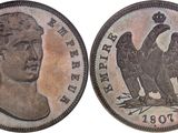 a close up of a coin with an eagle on it