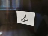 a close up of a number on a glass door