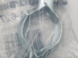 a metal clamp on a plastic bag on a table