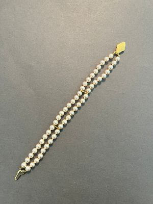 a close up of a beaded bracelet on a table