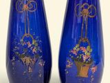 two vases that have been painted with flowers on them