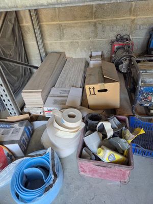a pile of assorted items sitting on the floor