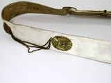 a belt that has a gold buckle on it