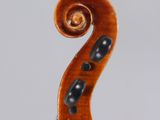 an antique violin with a scroll and a bow on a white background