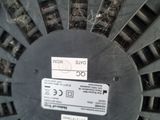 a close up view of a blower wheel with a label on it