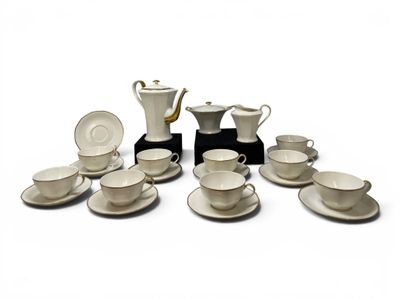 a lot of coffee cups and saucers sitting on a table