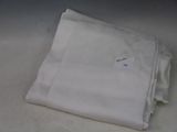 a stack of white napkins sitting on top of a table