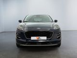 the front of a blue ford fiesta parked in a showroom