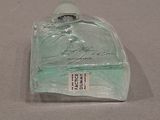 a bottle of perfume sitting on a table