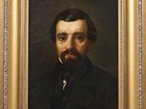 portrait of a man with a beard in a gold frame
