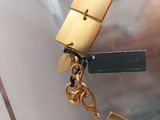 a gold lock with a key attached to it