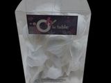 a clear box with a bunch of white flowers inside of it