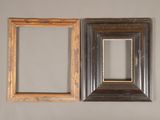 three different frames hanging on a wall in a room