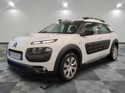 the white citrole is parked on a checkered floor